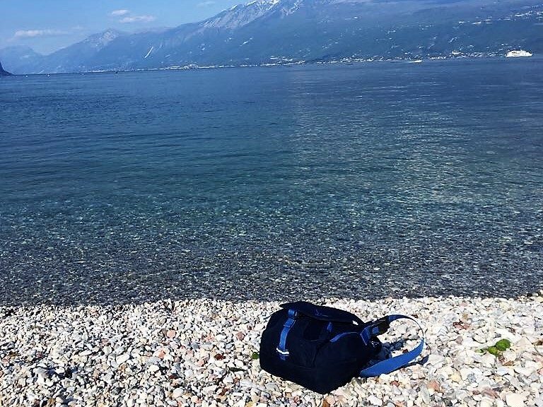 Lake Garda shore with Osprey messenger bag